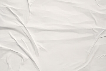 white crumpled and creased glued wrinkled paper poster texture background