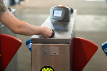 teen tapping on at the ferry terminal