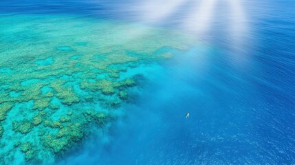 Obraz premium A stunning aerial view of the Great Barrier Reef, showcasing vibrant turquoise waters, intricate coral formations