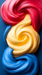 Swirling Red, Yellow, Blue Slime on Dark Background