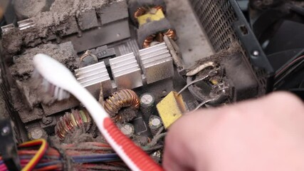 Cleaning dust from electronic components of a computer power supply