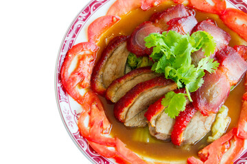 Top view of BBQ roast duck and pork with red gravy sauce, focus selective