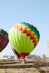 Colorful hot air balloons taking flight on a sunny day