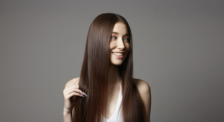 Naklejka premium beautiful happy young woman. smiling girl with healthy hair