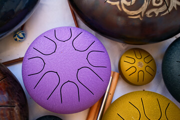 Collection of handpans in various colors and textures,