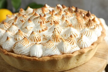 Delicious meringue pie on table indoors, closeup