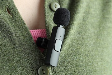 Woman with lavalier microphone on her shirt, closeup