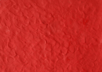 Red plasticine texture background. Modeling clay material pattern.
