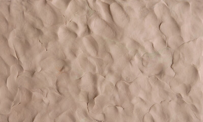 Brown plasticine texture background. Modeling clay material pattern.