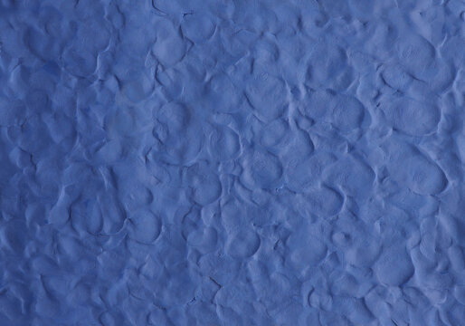 Blue plasticine texture background. Modeling clay material pattern.
