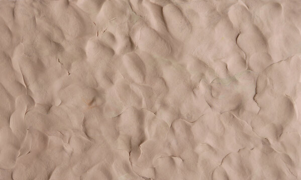 Brown plasticine texture background. Modeling clay material pattern.