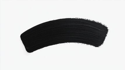 A black swatch of mascara on a white background.