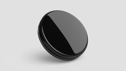 A black, circular object with a glossy finish.
