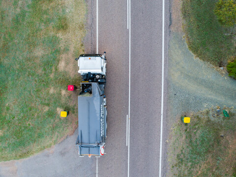 Aerial photo of garbage truck emptying bins in rural location