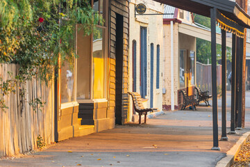 Looking along a footpath of old shop fronts and verandas