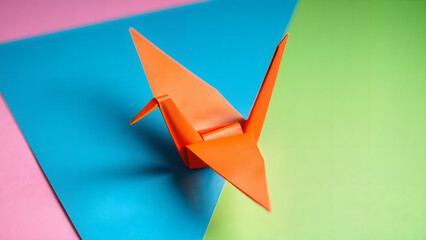 Elegant orange paper crane, soft and artistic