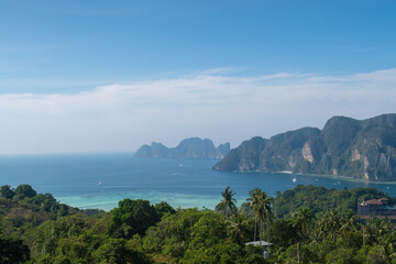 Naklejka premium Tropical Phi Phi Islands landscape in Thailand with turquoise ocean and lush jungle for summer travel promotion