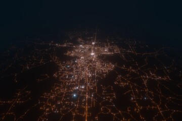Aerial view on Monroe (USA) from west. Top view on modern city at night from space