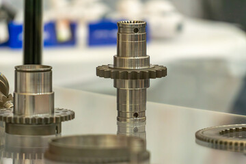 show of newly produced gear wheels with axles.