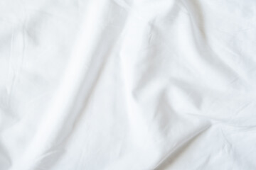 White bedsheet background, bed sheet texture, wrinkled duvet, crumpled satin blanket comforter cloth used in hotel, resort or home interior for bedding sleep comfort