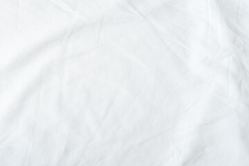 White bedsheet background, bed sheet texture, wrinkled duvet, crumpled satin blanket comforter cloth used in hotel, resort or home interior for bedding sleep comfort