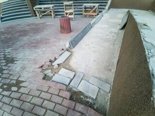 deteriorating exterior concrete staircase with rust stains and cracks, requiring specialized...