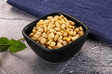 Peeled cedar nut in the bowl
