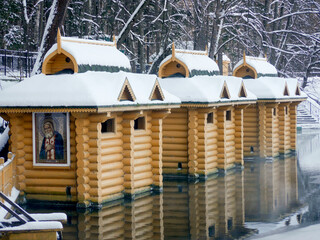 Font or baptistry in Diveevo. Chapel of St. Seraphim of Sarov, holy spring, baptismal font, winter Russia Diveevo, wooden church.