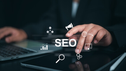 Businessman using a computer for analysis, SEO search engine optimization marketing Ranking traffic...