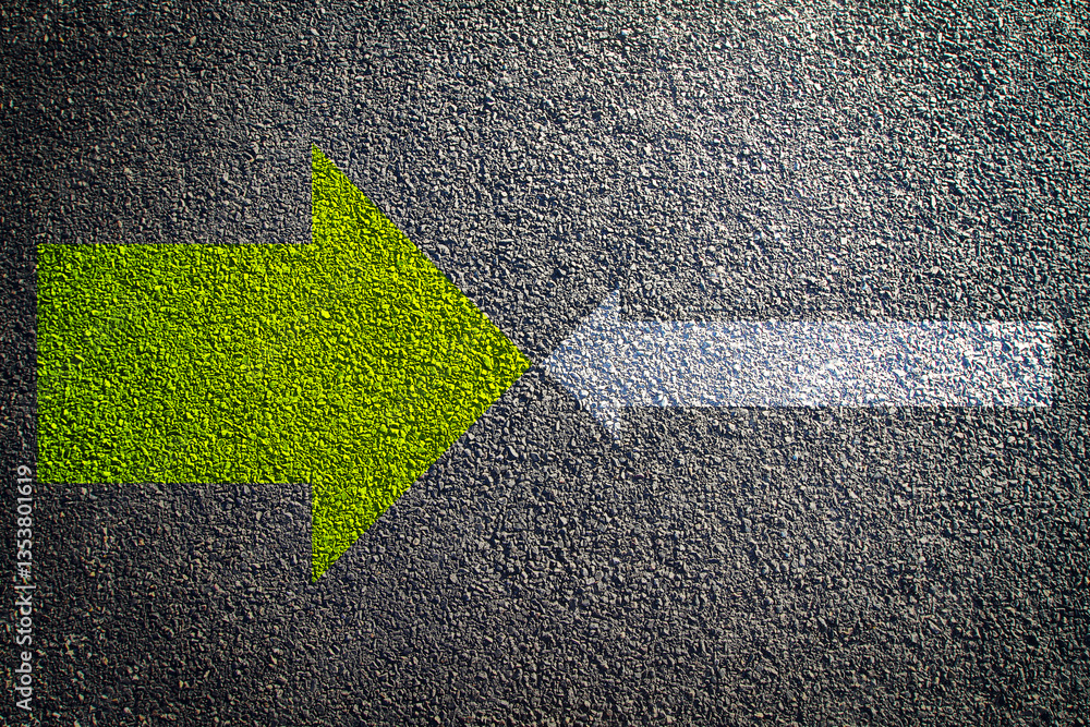 Poster contrasting directional arrows on asphalt background.