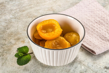 Canned marinated peach in syrop