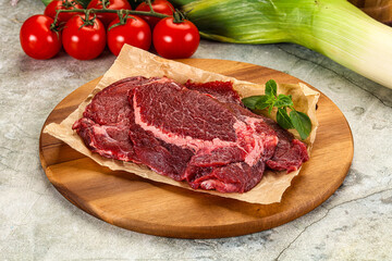 Raw beef cheeks cut for cooking
