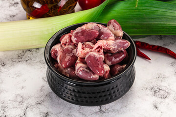 Raw chicken hearts in the bowl