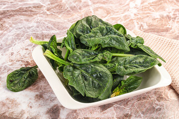 Fresh green spinach leaves heap