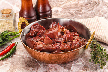 Raw uncokked chicken liver in the bowl