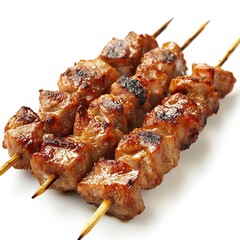 Three grilled pork skewers on white background.