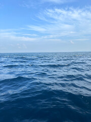 Fototapeta premium Minimalist Sunrise from a Yacht in the Indian Ocean, Blue Sky and Dark Clear Water, Sri Lanka