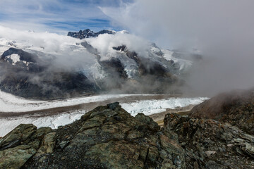 Panorama of cloud layer from mountain top over Swiss alps
