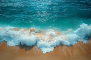 Fototapeta premium Azure Ocean Waves Crashing on Sandy Beach, Aerial View of Turquoise Water and White Foam