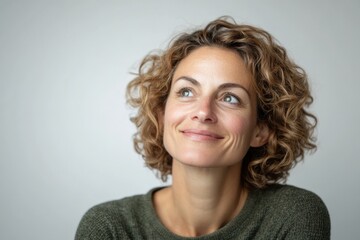 Woman looks up and smiles