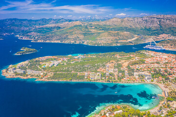 A breathtaking high-angle aerial view of Lapad Bay in Dubrovnik, Croatia, showcasing the stunning Adriatic coastline, deep blue waters, and the picturesque landscape of this iconic coastal destination