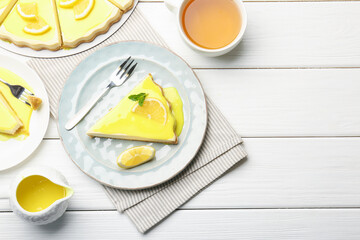Delicious cheesecake with lemon curd served on white wooden table, flat lay. Space for text