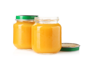 Baby food. Tasty puree in glass jars isolated on white