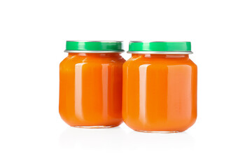 Baby food. Tasty puree in glass jars isolated on white