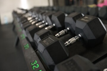 Naklejka premium Different many dumbbells in gym. Sport equipment
