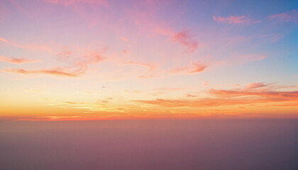 Serene sunset sky with pastel colors and wispy clouds  