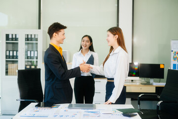 Group of Asian business meeting in planning design in creative business discussing work
