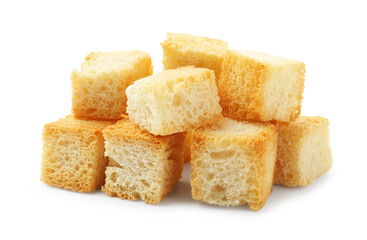 Many delicious crispy croutons isolated on white