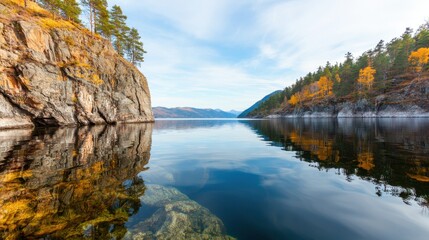 Reservoir surrounded by mountains and forests Concept, Serene Reservoir Embraced by Forested Cliffs and Rolling Hills Under a Clear Sky