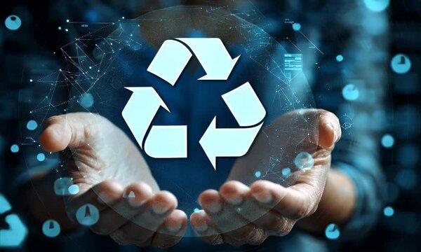 Recycling symbol held in hands